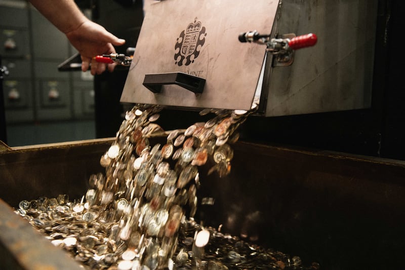 The King Charles III coins being struck at the Royal Mint