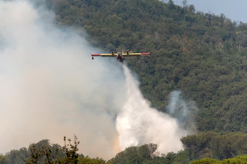 Emergency services tackle a wildfire at the Vesuvius National Park in Terzigno, near Naples, Italy. Photograph: Eliano Imperato
/AFP via Getty Images         