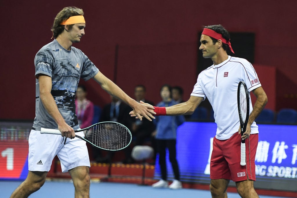 Alexander Zverev and Roger Federer in action at the the 2019 Hangzhou Tmall Tennis Invitational Tournament