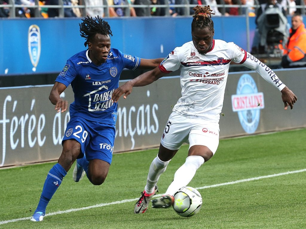Troyes' Burkinabe defender Issa Kabore (L) fights for the ball with Clermont's Senegalese defender Arial Mendy (R) during the French L1 football match between ES Troyes AC and Clermont Foot 63 at Stade de l'Aube in Troyes, north-eastern France on April 20, 2022.