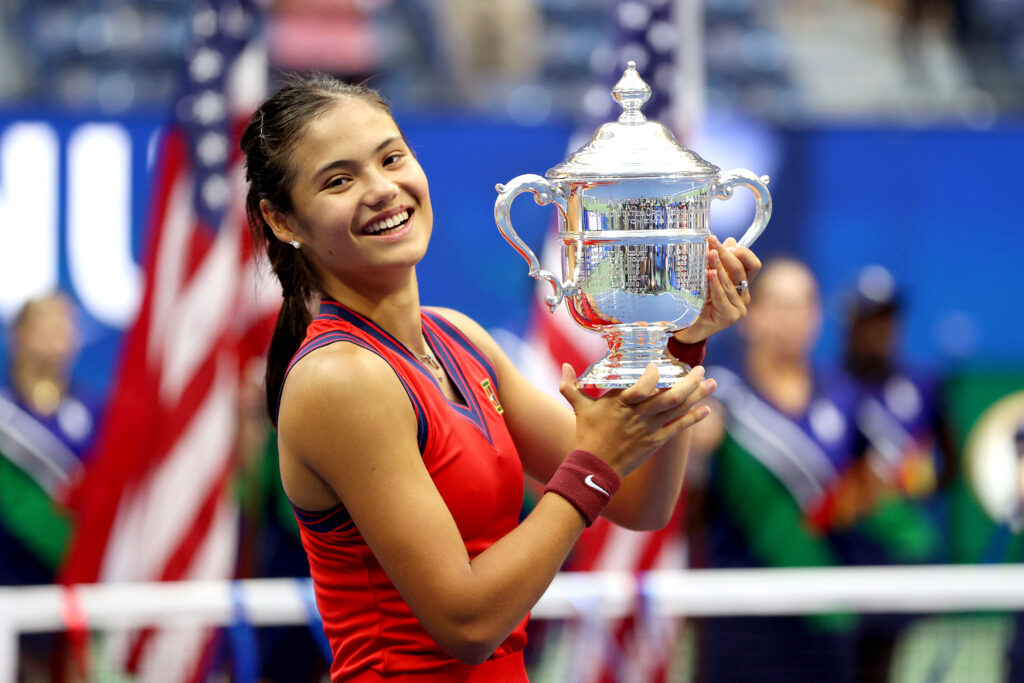 Emma Raducanu of Great Britain celebrates with the championship trophy after defeating Leylah Annie Fernandez of Canada during their Women's Singles final match on Day Thirteen of the 2021 US Open at the USTA Billie Jean King National Tennis Center on September 11, 2021 in the Flushing neighborhood of the Queens borough of New York City.