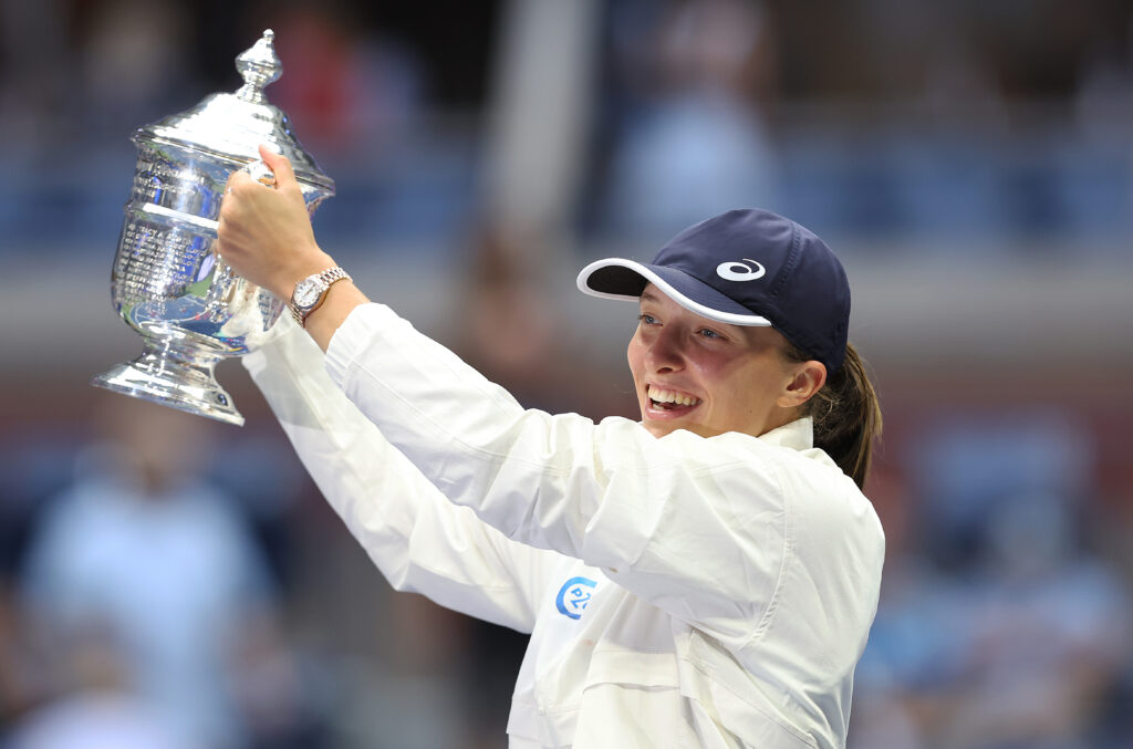 Iga Swiatek of Poland celebrates with the championship trophy after defeating Ons Jabeur of Tunisia during their Women’s Singles Final match on Day Thirteen of the 2022 US Open at USTA Billie Jean King National Tennis Center on September 10, 2022 in the Flushing neighborhood of the Queens borough of New York City.