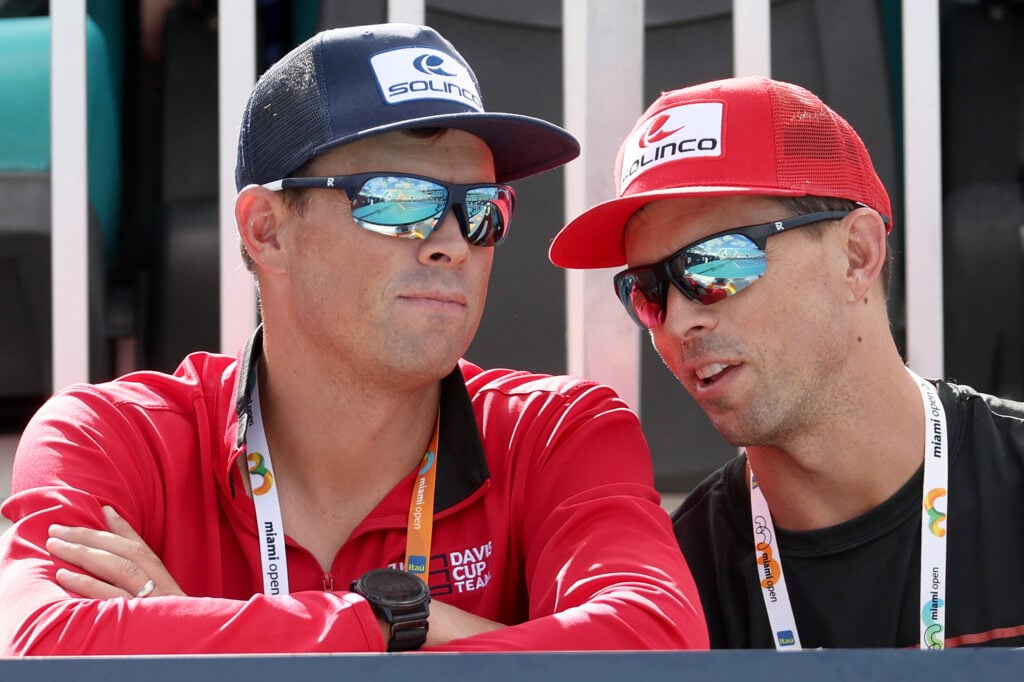Bob Bryan and Mike Bryan watch on from the stands during the 2023 Miami Open