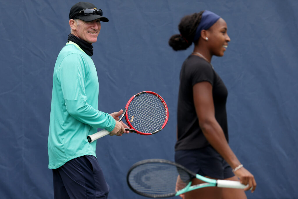 Brad Gilbert watches Coco Gauff of United States train in preparation for the US Open at the USTA Billie Jean King National Tennis Center on August 24, 2023 in New York City.