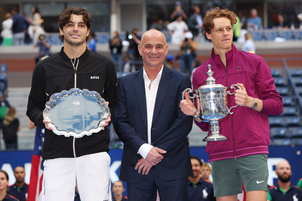 Taylor Fritz of the United States, Andre Agassi and Jannik Sinner of Italy pose for a photo following Sinner's Men's Singles Final victory on Day Fourteen of the 2024 US Open at USTA Billie Jean King National Tennis Center on September 08, 2024 in the Flushing neighborhood of the Queens borough of New York City.