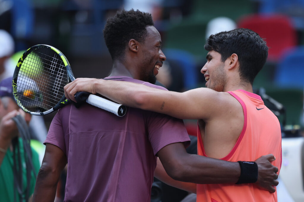 Carlos Alcaraz of Spain and Gael Monfils of France shake hands at the net after the Men's singles fourth round match against on Day 10 of 2024 Shanghai Rolex Masters at Qi Zhong Tennis Centre on October 09, 2024 in Shanghai, China.