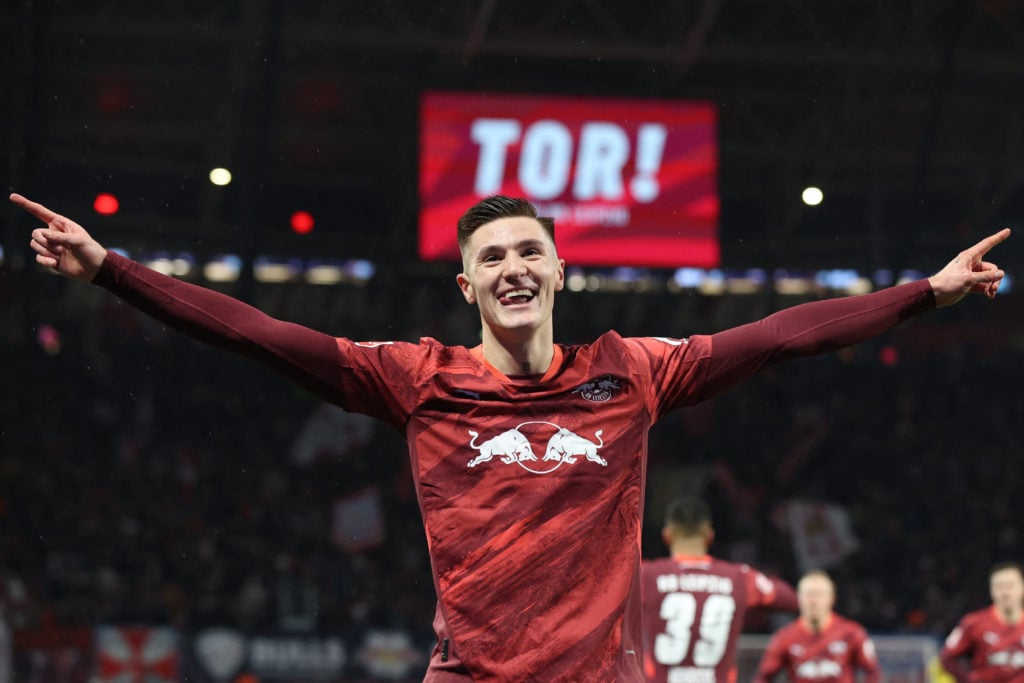 Benjamin Sesko celebrates scoring for RB Leipzig.