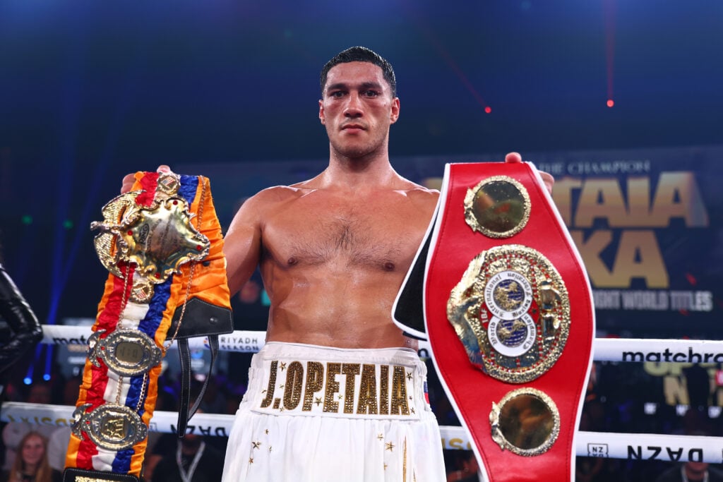 Jai Opetaia poses with belts