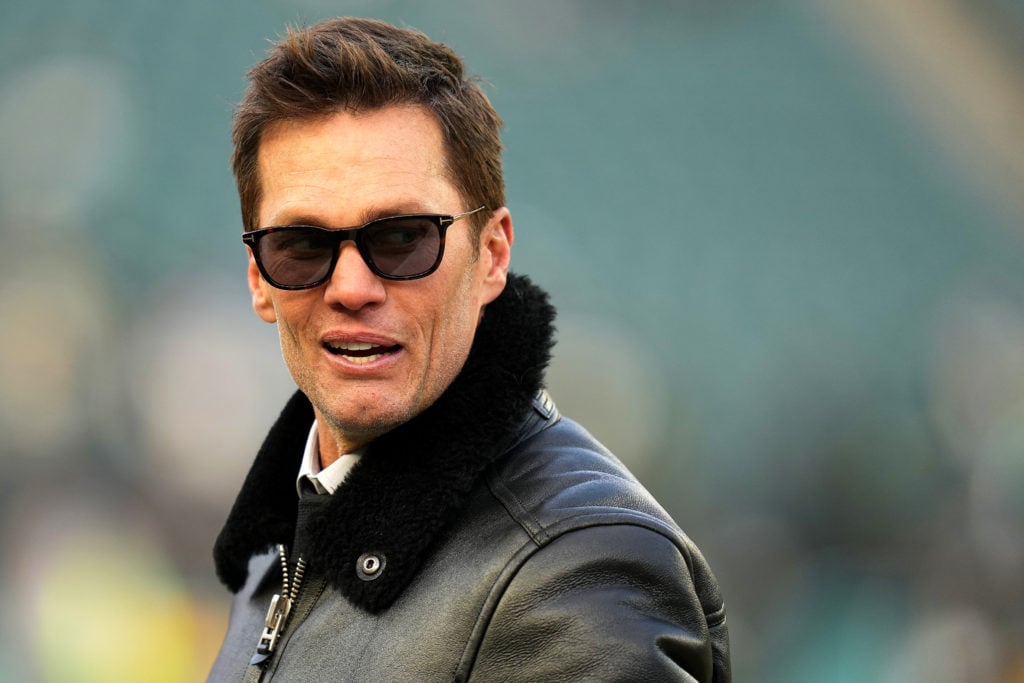 Former NFL Player Tom Brady looks on prior to the NFC Wild Card Playoff between the Green Bay Packers and the Philadelphia Eagles