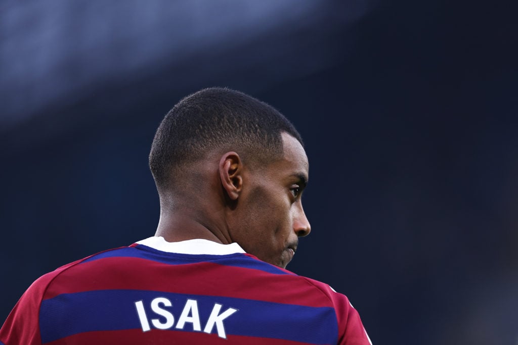 Newcastle United striker Alexander Isak with his back to the camera