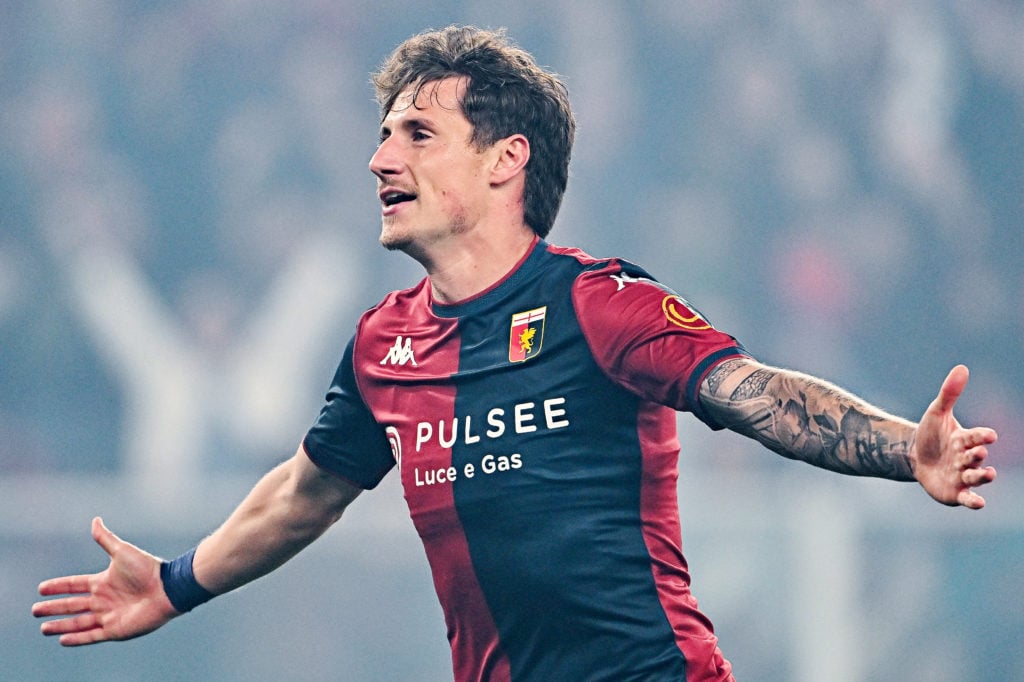 Andrea Pinamonti celebrates scoring a goal for Genoa.