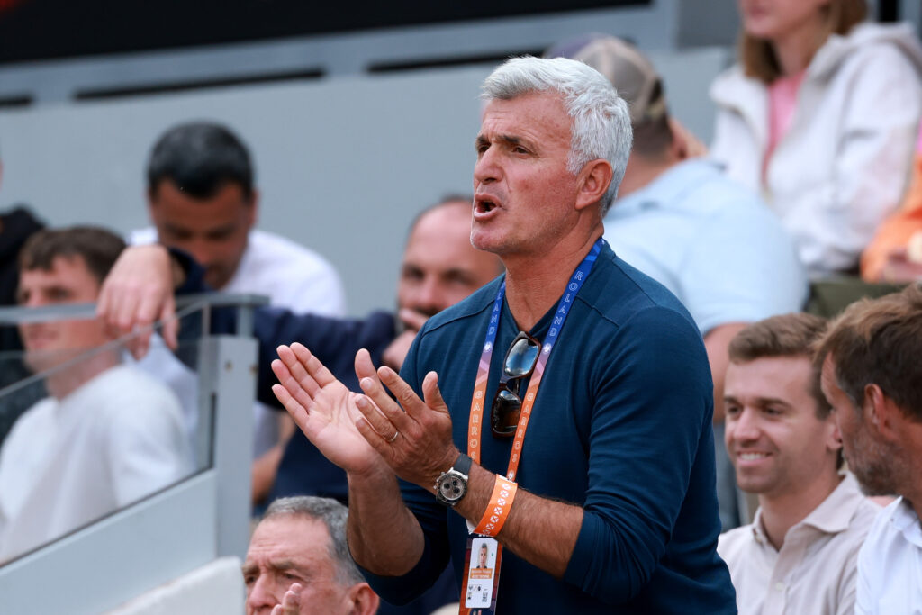 Apostolos Tsitsipas, father of Stefanos Tsitsipas of Greece, applauds as he plays against Matteo Gigante of Italy in the during the Men's Singles Second Round match on Day Four of the 2025 French Open at Roland Garros on May 28, 2025 in Paris, France.