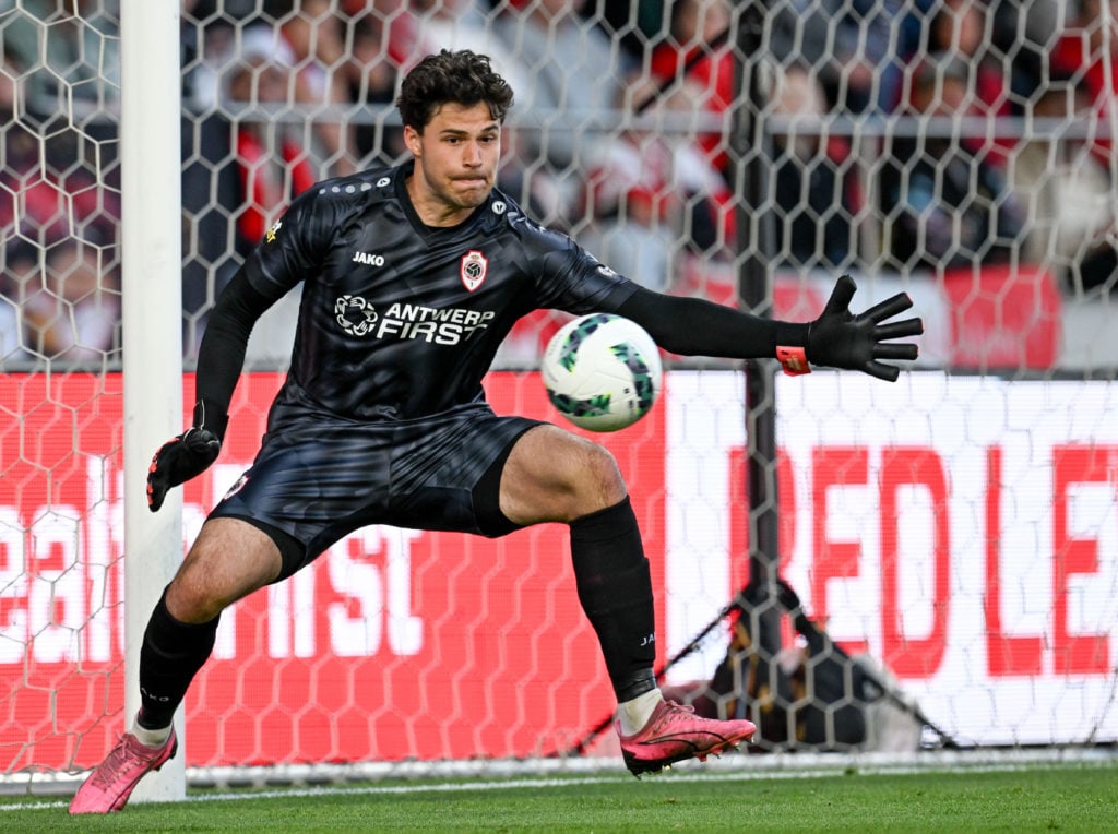 Senne Lammens saves a shot with his left hand