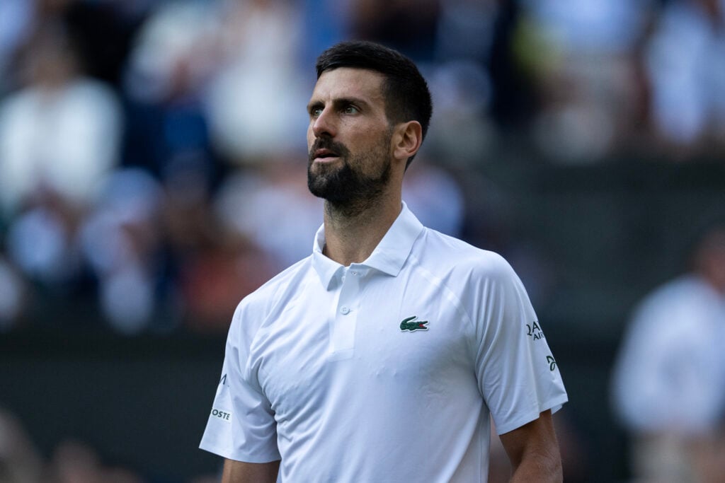 Novak Djokovic of Serbia looks on against Flavio Cobolli of Italy during the Gentlemen's Singles quarter-final match on day ten of The Championships Wimbledon 2025 at All England Lawn Tennis and Croquet Club.