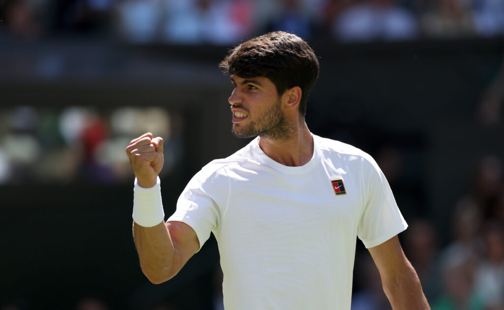 Carlos Alcaraz of Spain celebrates a point against Taylor Fritz of United States during the Gentlemen's Singles semi-final match on day twelve of The Championships Wimbledon 2025 at All England Lawn Tennis and Croquet Club on July 11, 2025 in London, England.
