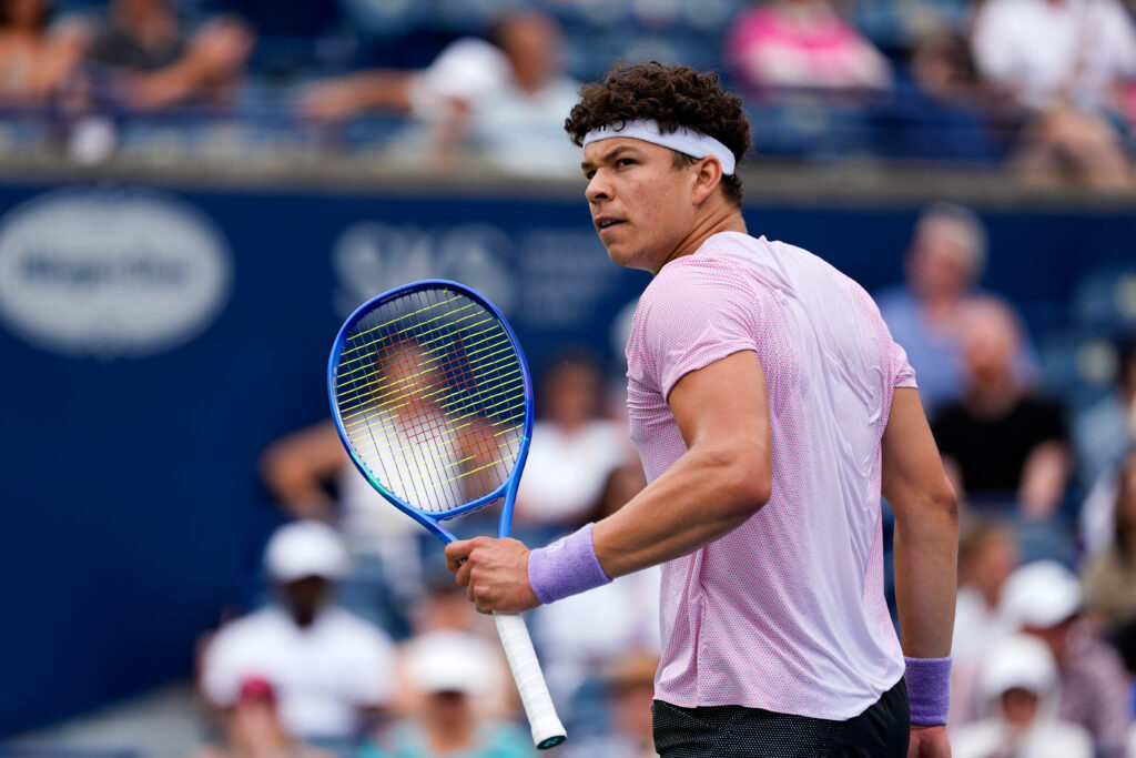 Ben Shelton shakes his racket in celebration