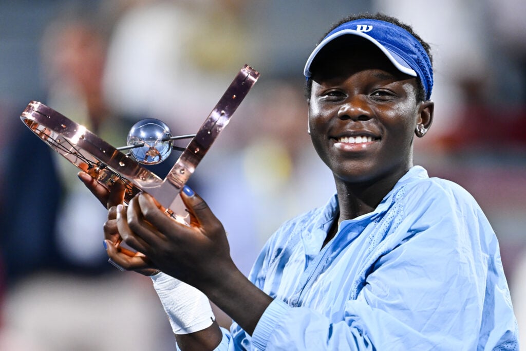 Victoria Mboko celebrates with the Canadian Open title after beating Naomi Osaka in the final