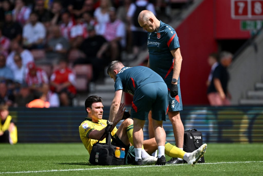 Kieffer Moore of Wrexham receives medical treatment