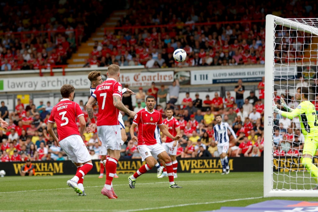 Isaac Price scores during Wrexham AFC v West Bromwich Albion in the Sky Bet Championship clash.