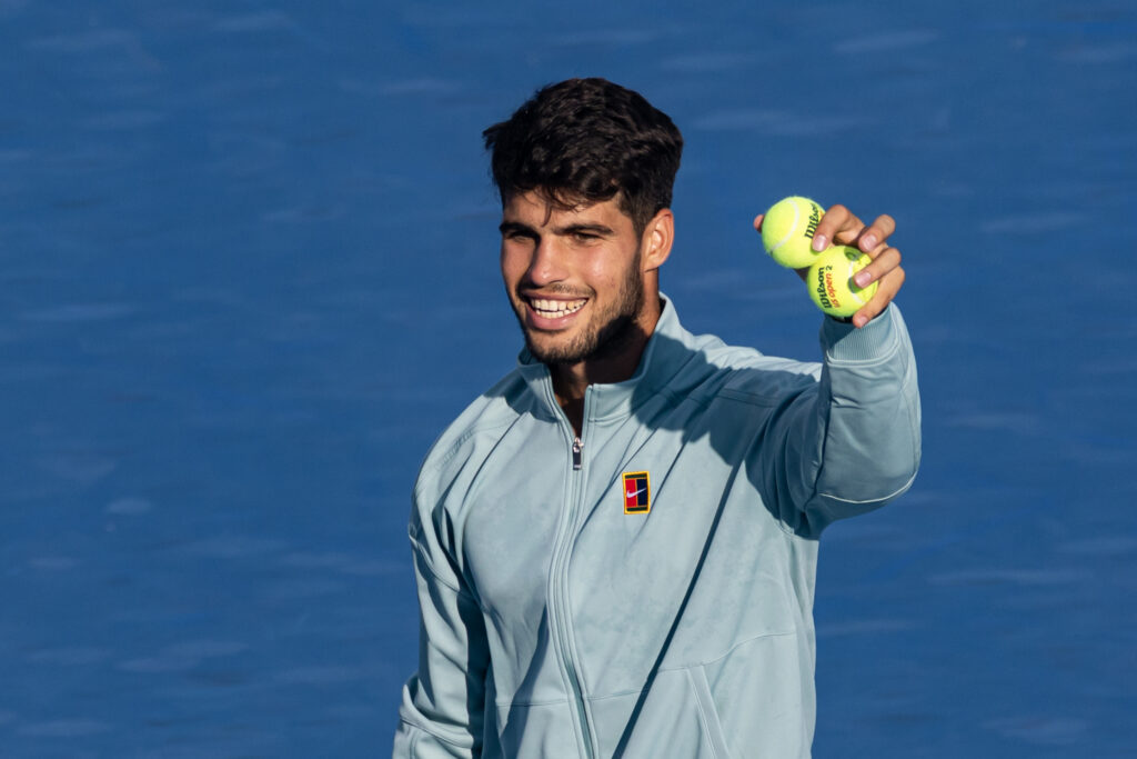 Carlos Alcaraz smiles