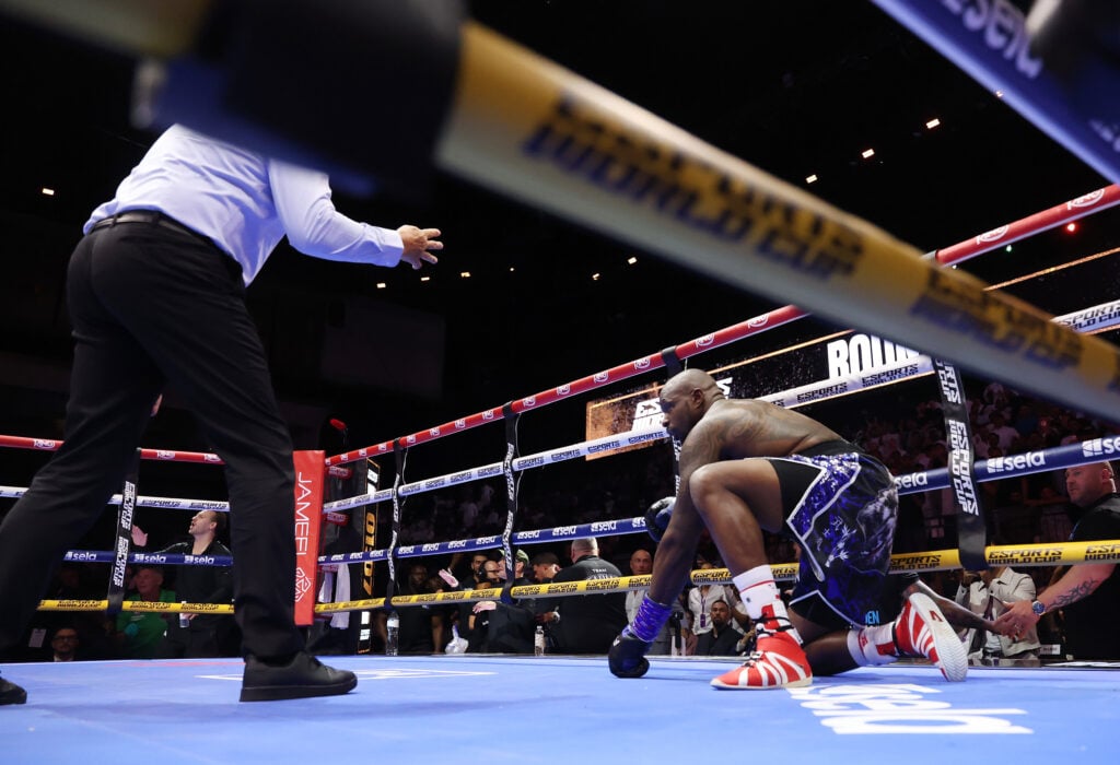 Dillian Whyte on his knee on the canvas after KO loss to Itauma