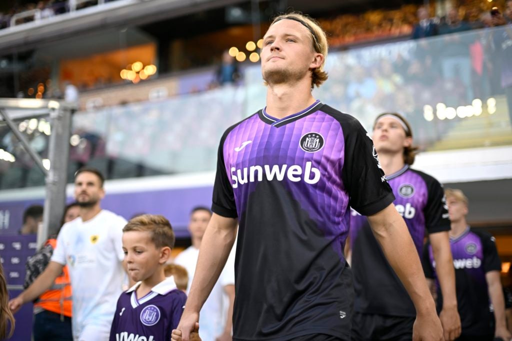 Kasper Dolberg walks out with his Anderlecht side before playing against AEK Athens