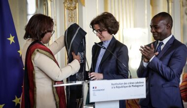 Madagascar's Minister of Culture Volamiranty Donna Mara (L) offers a gift to her France's contrepart Rachida Dati flanked by France's Delegate Minister for Francophonie and International Partnerships Thani Mohamed Soilihi during a ceremony for the restitution of three Sakalava skulls to Madagascar, at the Culture Ministry in Paris, on August 26, 2025. France returns three human skulls to Madagascar dating from the colonial era, including one attributed to the Sakalava king Toera who was beheaded by French troops in 1897, in application of a law on the restitution of human remains. (Photo by STEPHANE DE SAKUTIN / AFP) (Photo by STEPHANE DE SAKUTIN/AFP via Getty Images)