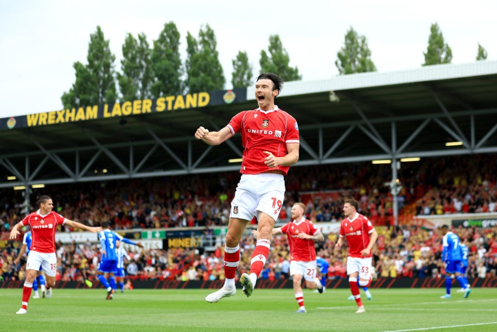 Kieffer Moore of Wrexham celebrates scoring.