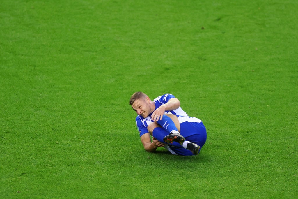 Paul Mullin of Wigan Athletic reacts after a challenge