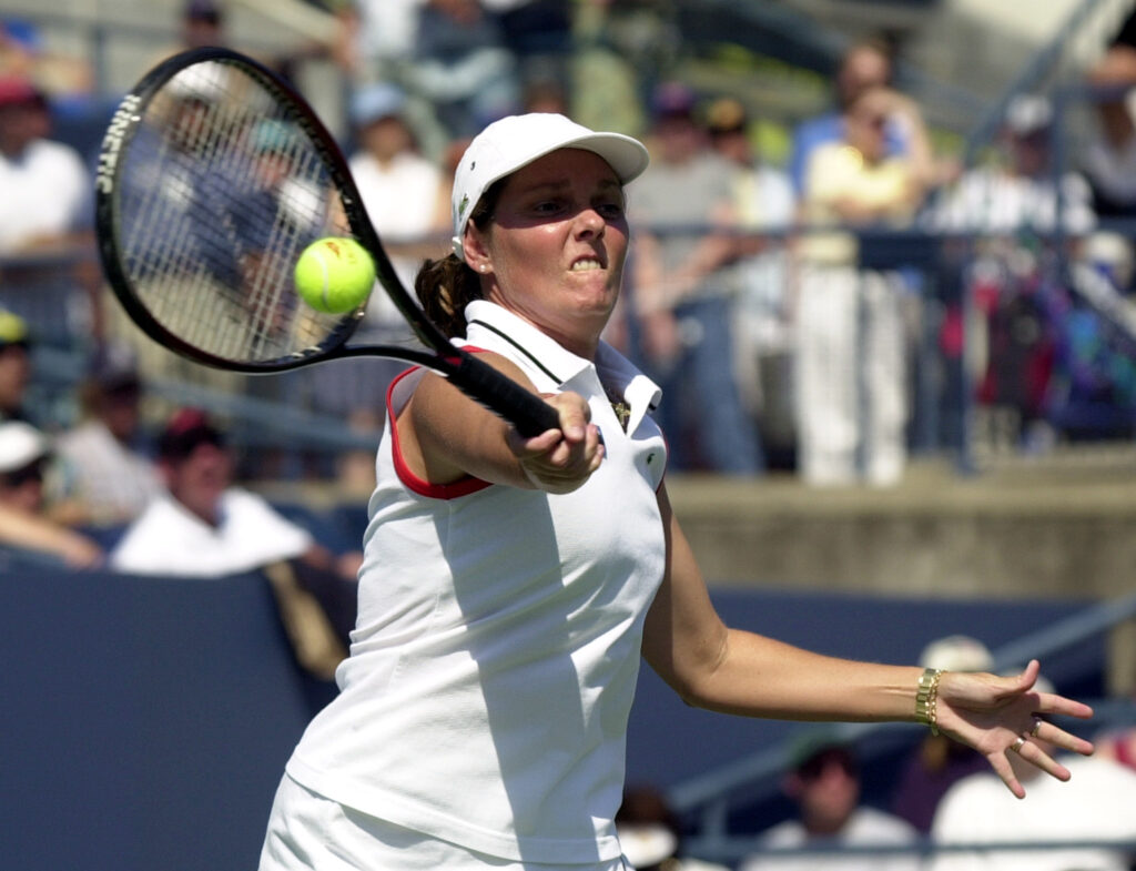 Ninth seeded Nathalie Tauziat of France returns the volley to eigth seeded Amelie Mauresmo of France during their match at the US Open in Flushing Meadows, New York, 03 September 2001.