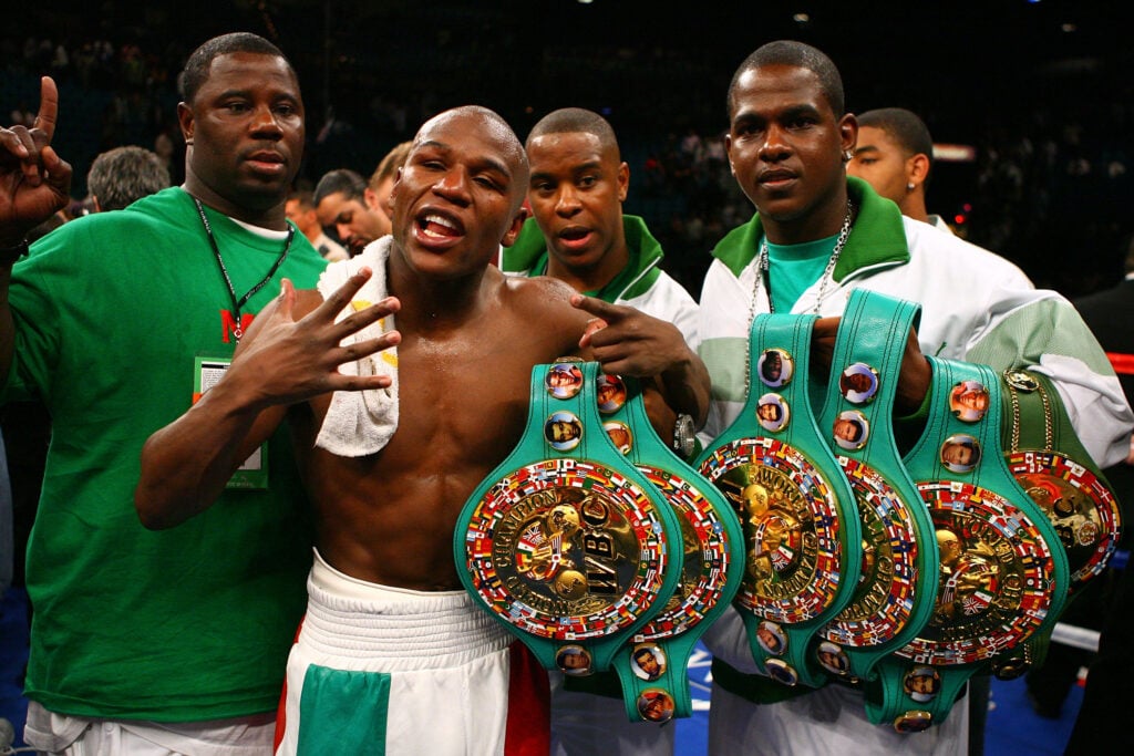 Floyd Mayweather celebrates defeating Oscar De La Hoya