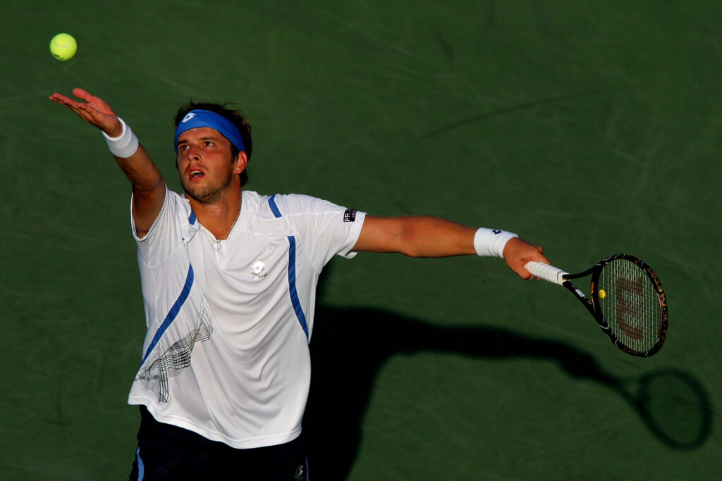 Gilles Muller of Luxembourg serves against Nikolay Davydemko of Russia during Day 9 of the 2008 U.S. Open at the USTA Billie Jean King National Tennis Center on September 2, 2008 in the Flushing neighborhood of the Queens borough of New York City.