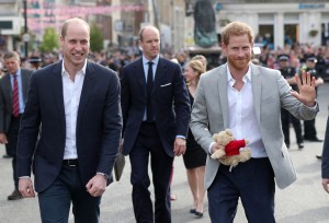 Britain's Prince Harry (R) and Prince Harry's brother and best man Prince William, Duke of Cambridge greet well-wishers on the street outside Windsor Castle in Windsor on May 18, 2018, the eve of Britain's Prince Harry's royal wedding to US actress Meghan Markle. Britain's Prince Harry and US actress Meghan Markle will marry on May 19 at St George's Chapel in Windsor Castle. (Photo by Jonathan Brady / POOL / AFP) (Photo by JONATHAN BRADY/POOL/AFP via Getty Images)
