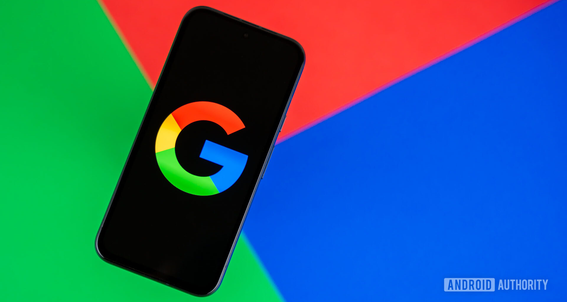 Google or Google Search logo on smartphone, with colorful background stock photo (2)