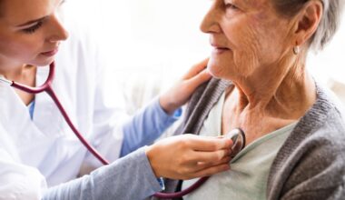 A doctor examining an older patient.