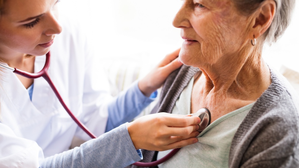 A doctor examining an older patient.
