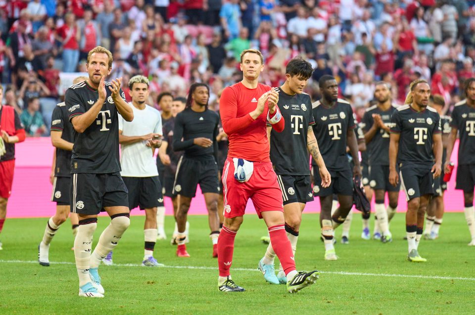 MUNICH, GERMANY - AUGUST 7: Manuel Neuer, goalkeeper of FC Bayern München and Harry Kane of FC Bayern München celebrate after the pre-season friendly match as part of the Telekom Cup between FC Bayern München and Tottenham Hotspur at Allianz Arena on August 7, 2025 in Munich, Germany. (Photo by EyesWideOpen/Getty Images)