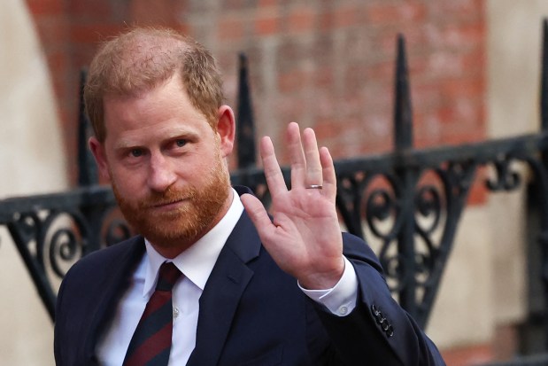 Britain's Prince Harry, Duke of Sussex waves as he departs the the Royal Courts of Justice, Britain's High Court, in central London, on April 9, 2025 following the second day of his appeal hearing to over the downgrading of his personal security during visits in Britain. Prince Harry's lawyer outlined in court threats made against him, including calls for his murder, as King Charles's youngest son appealed on April 8, 2025 against an "unjustified" decision to restrict his police protection in the UK. (Photo by HENRY NICHOLLS / AFP) (Photo by HENRY NICHOLLS/AFP via Getty Images)