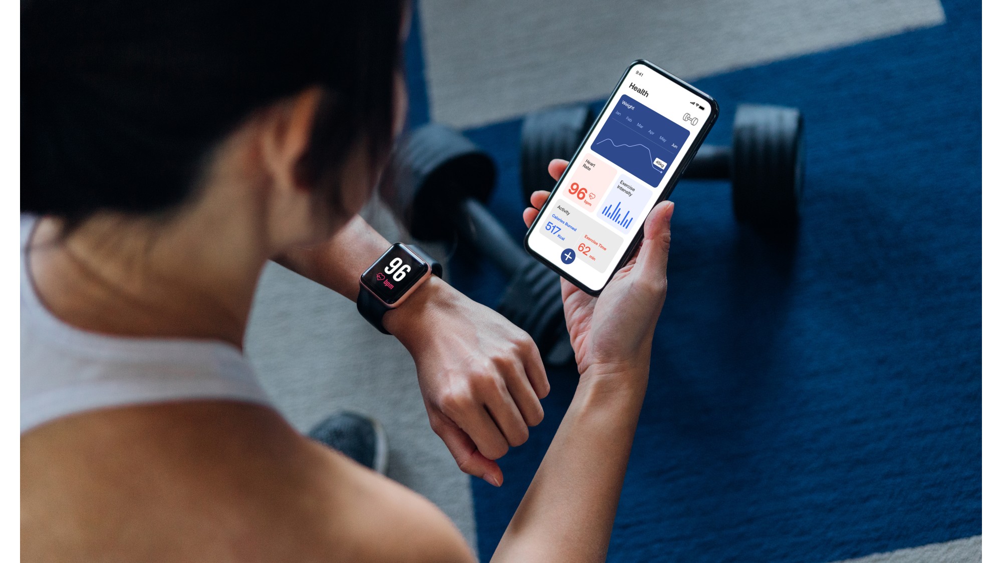Woman using one of the best workout apps and syncing it with her watch