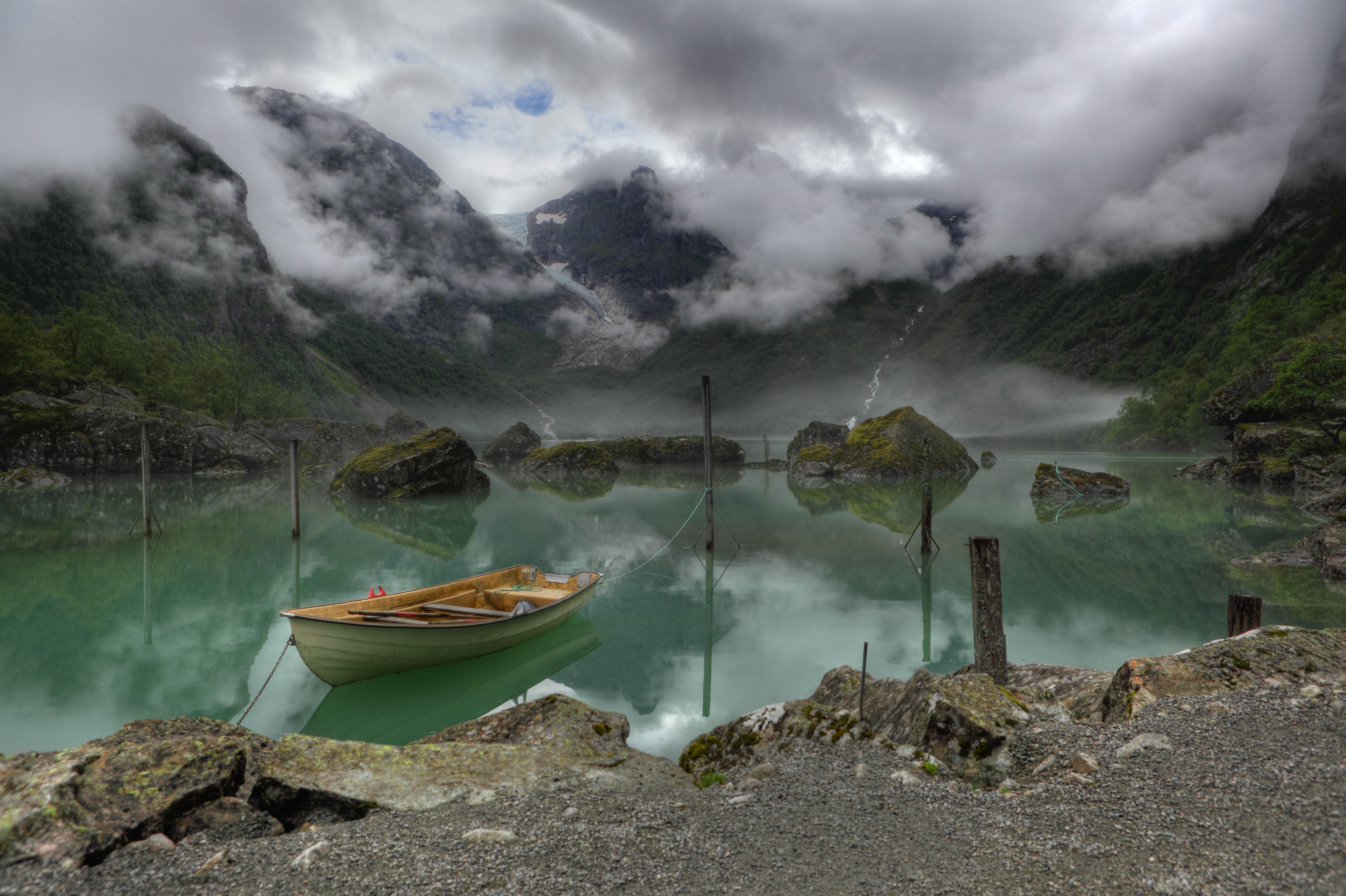 The search was suspended on Tuesday due to severe weather, including heavy rain and strong winds, police told NRK.