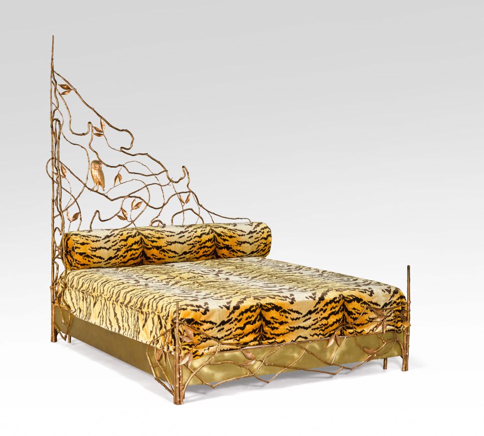 Claude Lalanne’s Unique Structure Végétale bed, with bronze floral vines curling around a tiger-stripe upholstered frame.