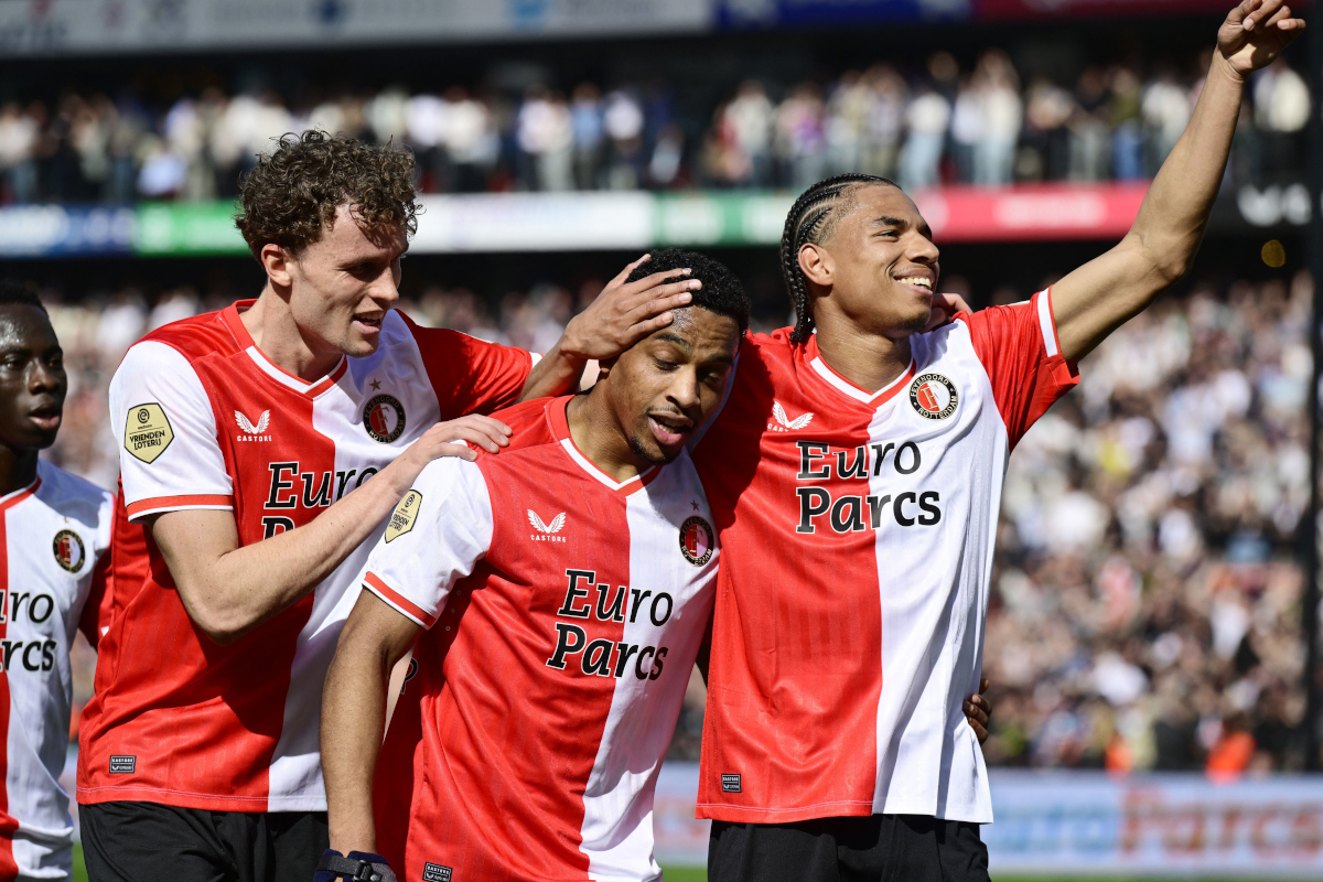 Feyenoord's dutch midfielder #20 Mats Wieffer, Feyenoord's Dutch midfielder #08 Quinten Timber and Feyenoord's Dutch midfielder #10 Calvin Stengs celebrate the 5-0 during the Dutch Eredivisie match between Feyenoord and Ajax at Feyenoord Stadium de Kuip on April 7, 2024 in Rotterdam, Netherlands. (Photo by Olaf Kraak / ANP / AFP) / Netherlands OUT (Photo by OLAF KRAAK/ANP/AFP via Getty Images)