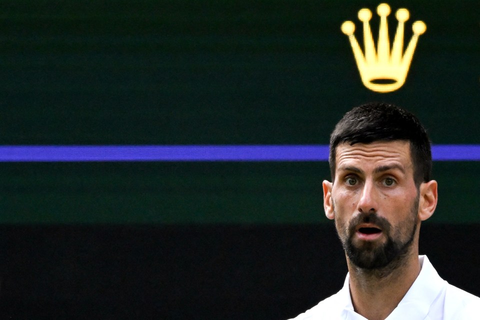 TOPSHOT - Serbia's Novak Djokovic reacts as he plays against Italy's Flavio Cobolli during their men's singles quarter-final tennis match on the tenth day of the 2025 Wimbledon Championships at The All England Lawn Tennis and Croquet Club in Wimbledon, southwest London, on July 9, 2025. (Photo by Kirill KUDRYAVTSEV / AFP) / RESTRICTED TO EDITORIAL USE (Photo by KIRILL KUDRYAVTSEV/AFP via Getty Images)