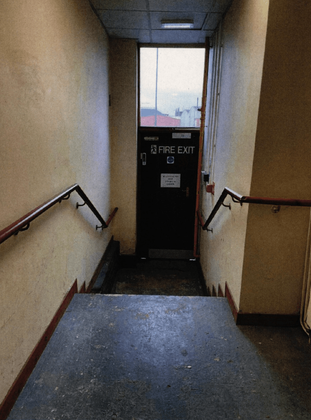 Stairs leading to a fire exit.