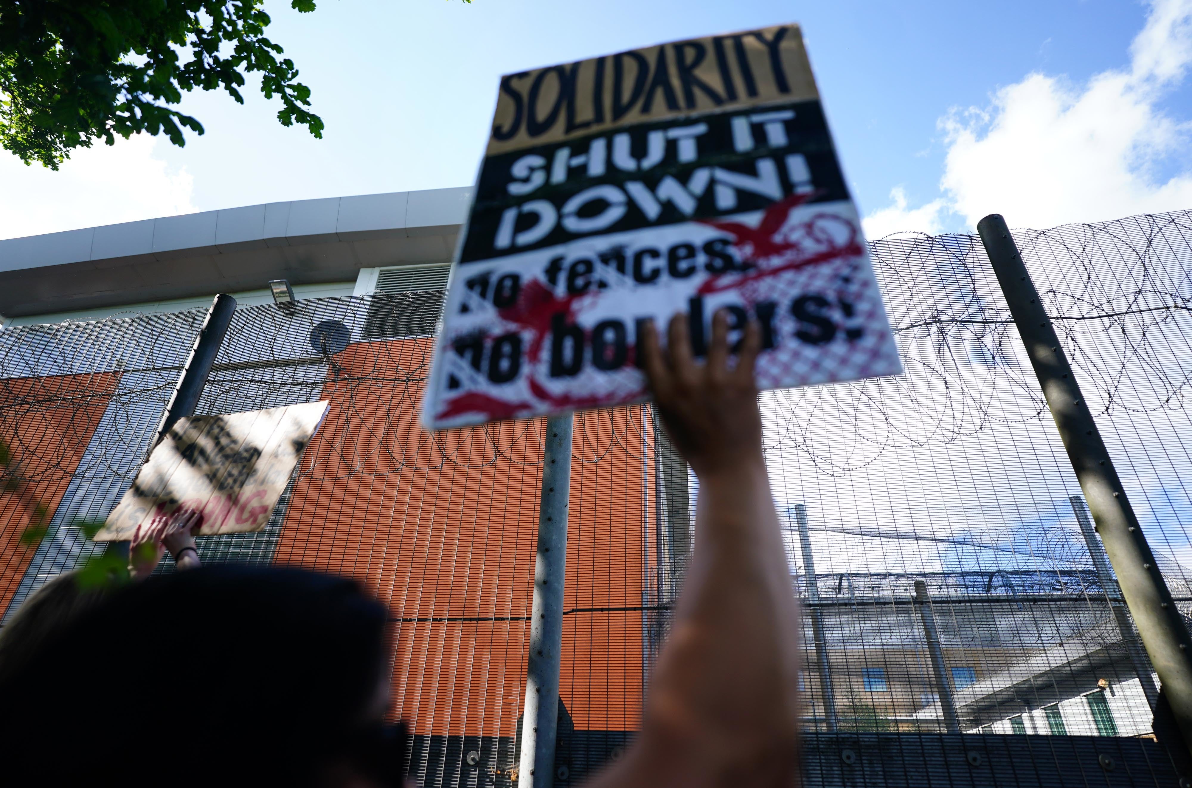 Migrant rights groups hold a show of support for people detained at Brook House Immigration Removal Centre at Gatwick who were scheduled to be sent to Rwanda, in June 2022