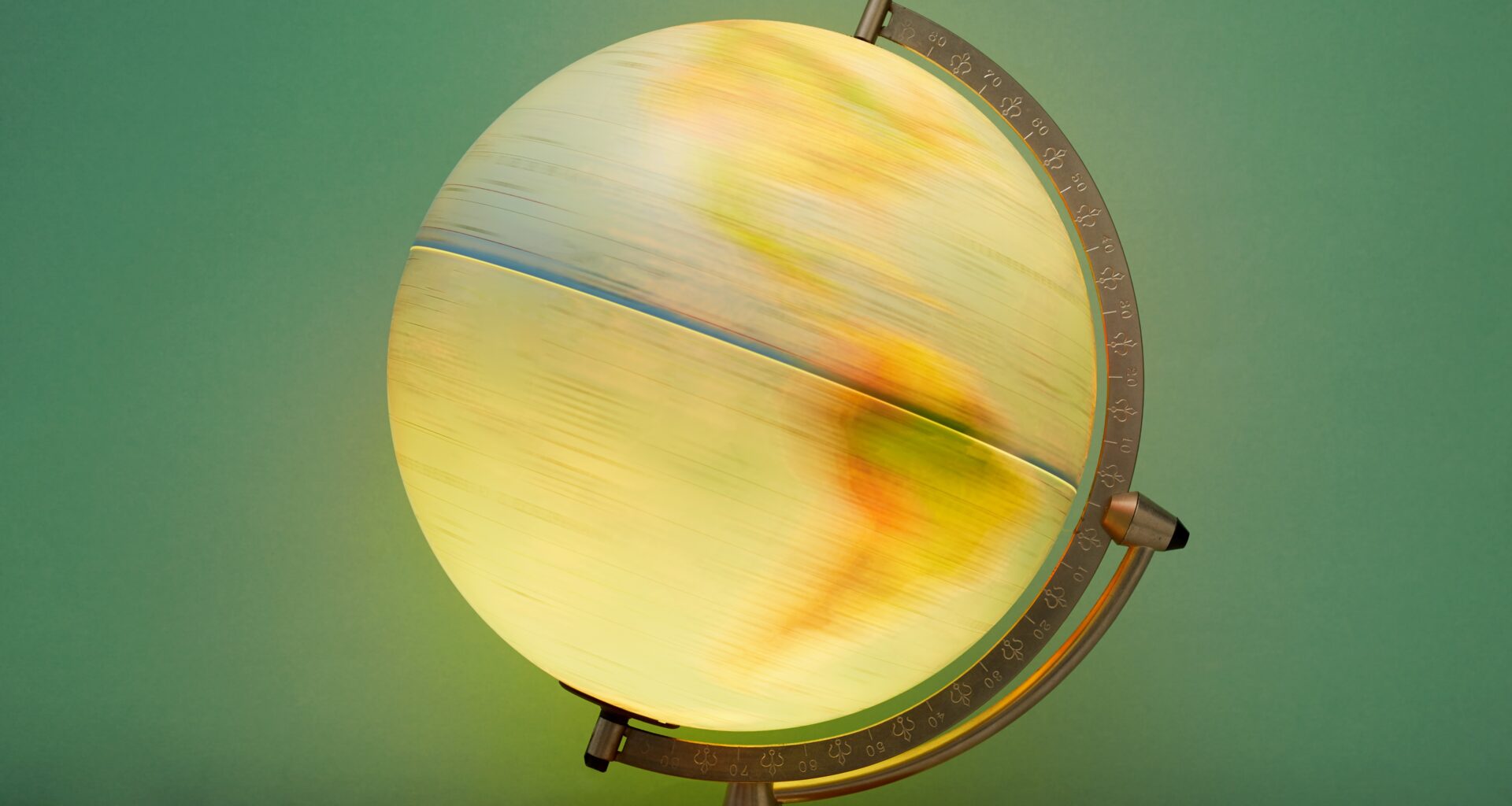 a globe spinning against a green background.