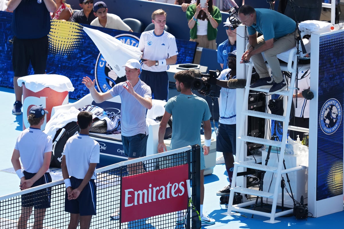 Jannik Sinner apologises to the crowd after retiring from the Cincinnati Open final