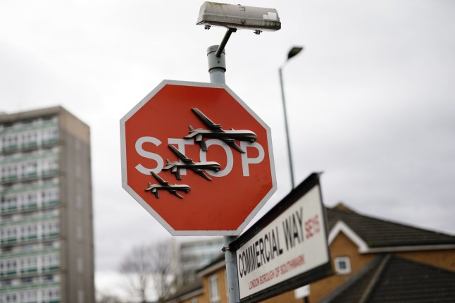 Banksy has unveiled a new piece of art work at the intersection of Southampton Way and Commercial Way in Peckham, south east London, which shows three planes perched on a stop sign. Picture date: Friday December 22, 2023. PA Photo. See PA story ARTS Banksy. Photo credit should read: Aaron Chown/PA Wire