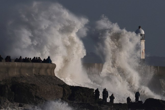 People view large waves as Storm Eowyn arrives, in Porthcawl, Wales, Britain, January 24, 2025. REUTERS/Toby Melville