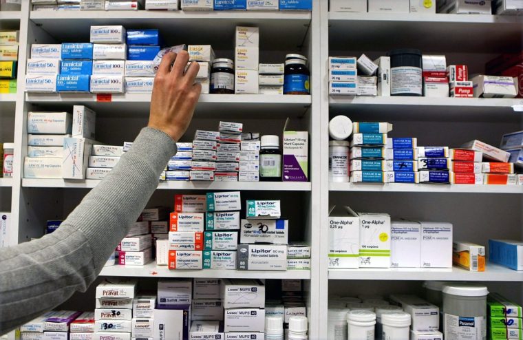 EMBARGOED TO 0001 MONDAY JUNE 30 File photo dated 16/11/09 of a pharmacist stocking shelves at a chemist. Patient stress and health risks due to medicine shortages is the 